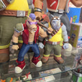 Action figure of a character in a dynamic pose with colorful outfit and accessories.