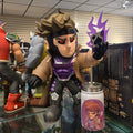 Toy figure with a purple and black design on a glass display case.