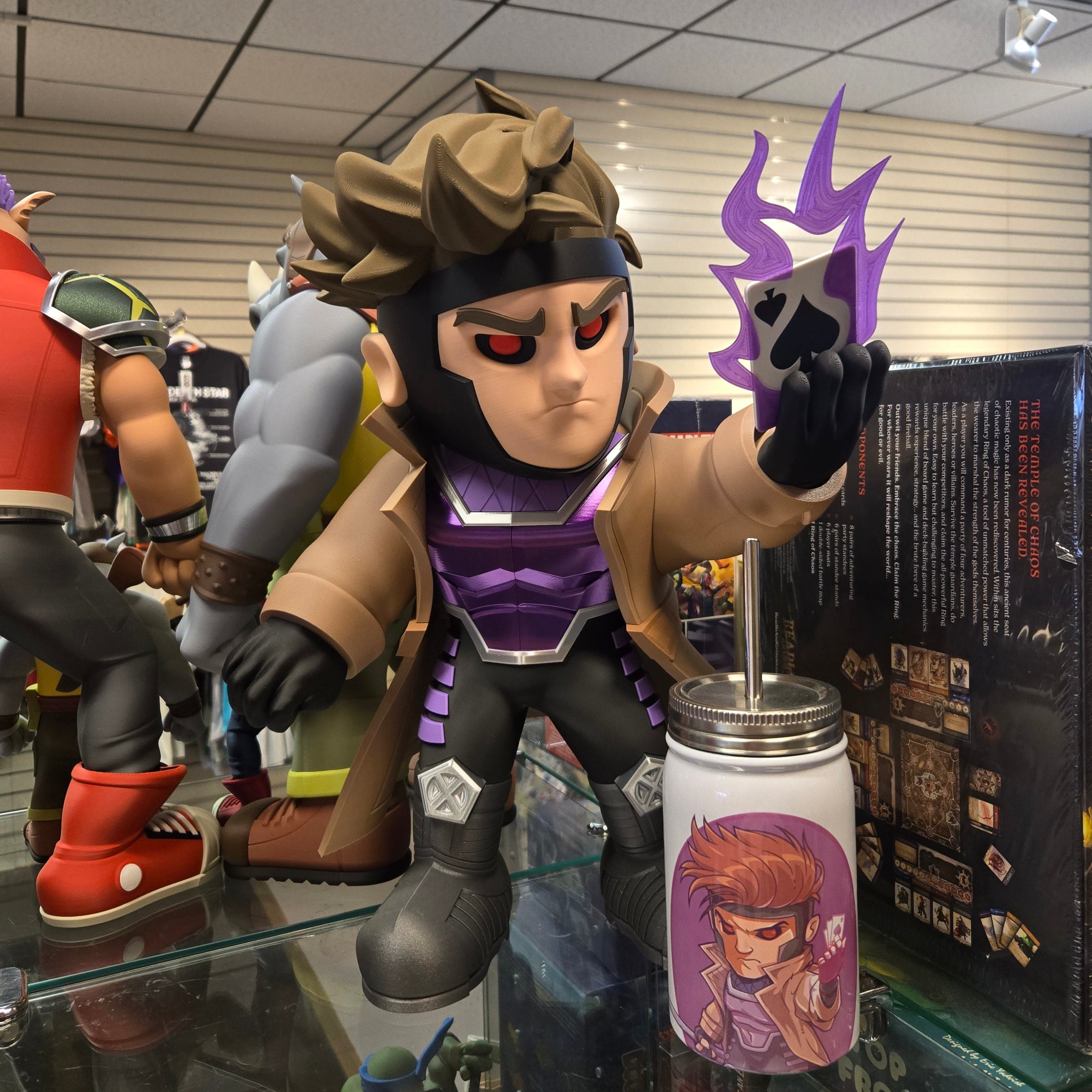 Toy figure with a purple and black design on a glass display case.