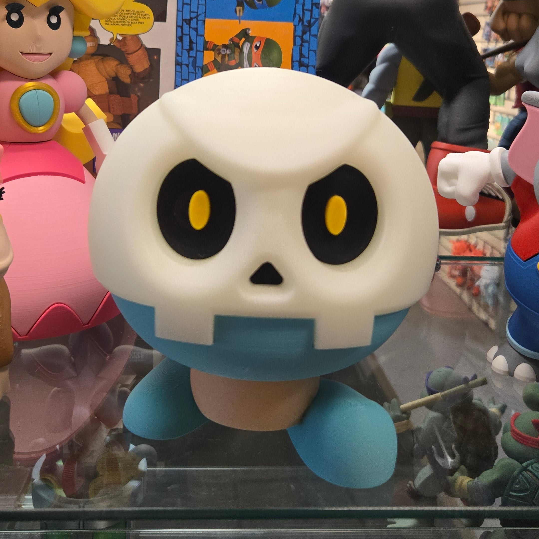 Collection of colorful cartoon character figurines in a display case.
