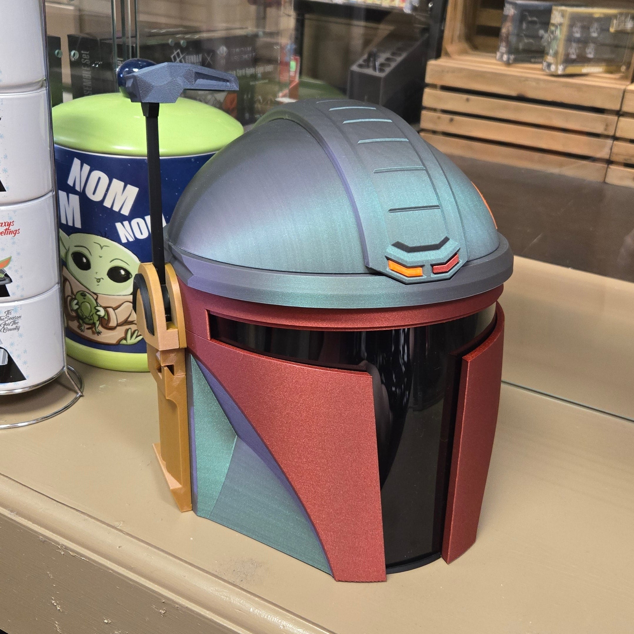 Colorful helmet on a stand with a store interior in the background