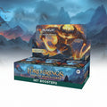 Box of 'Magic: The Gathering' and 'The Lord of the Rings' set boosters with dragon illustration.