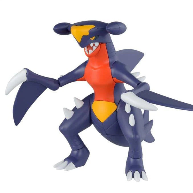 Toy figure of a blue and orange creature on a white background