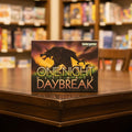 Board game box for 'One Night Ultimate Daybreak' with a horse silhouette on a dark background.