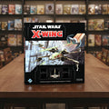 Star Wars X-Wing game box with X-wing fighter on a white background