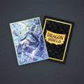 Card with dragon design and Dragon Shield packaging on a white background