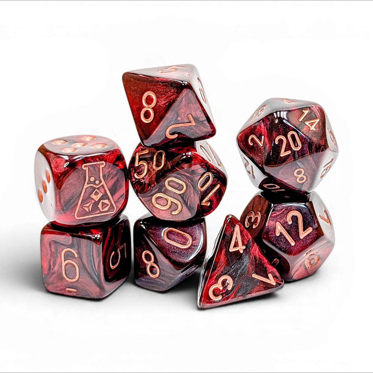A set of red translucent polyhedral gaming dice with gold-colored numbers, arranged in a small pile on a white background.