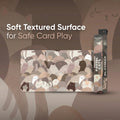 Playmat packaging with cat design and text about soft textured surface for safe card play.