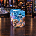 A Magic: The Gathering collectible card box printed with fantasy artwork featuring a white-robed mage and fiery beast illustrations, shown on a light gray studio background.