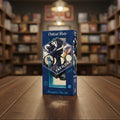 Vaxildan dice set packaging with blue and black design
