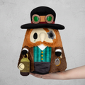 Steampunk-themed plush toy held in a hand against a white background