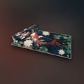 Decorative mat with floral and fish design on a dark background