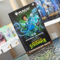 Card game box for 'Magic: The Gathering' with a character illustration on a table.