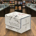 Decorative box with text and compass design on a white background