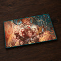 Magic: The Gathering playmat featuring a detailed fantasy illustration of a warrior with red hair and a sword, surrounded by fiery orange and blue elements, shown on a plain white background.