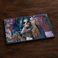 Magic: The Gathering playmat featuring a detailed fantasy illustration of a skeletal grim reaper figure in a dark hooded cloak, surrounded by mystical artifacts and purple-toned magical elements. The Magic logo is visible in the bottom-left corner.