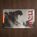 Godzilla-themed mouse pad with Japanese text and Universus logo on a white background