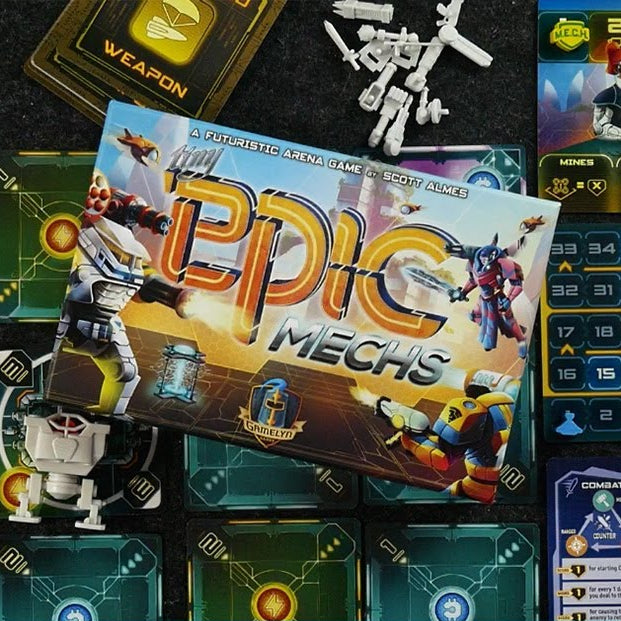 Board game packaging for 'Epic Mechs' with game pieces and cards on a dark surface.