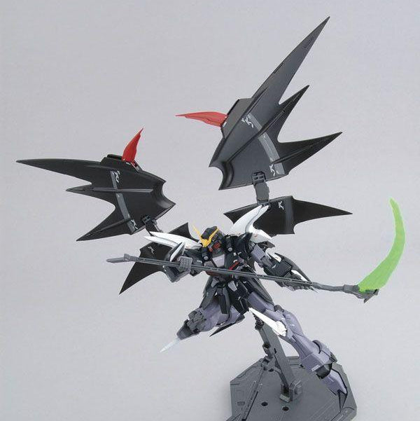 Model kit of a black and gray robot with red accents on a white background, featuring the Sotsu and Sunrise logos.