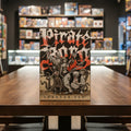 Pirate Borg Starter Set packaging with illustrated characters on a dark background