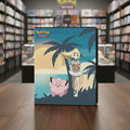 A Pokémon Trading Card Game box shown at a slight angle on a plain white background. The box art features a beach scene with palm trees, a blonde trainer character, and a pink Jigglypuff.